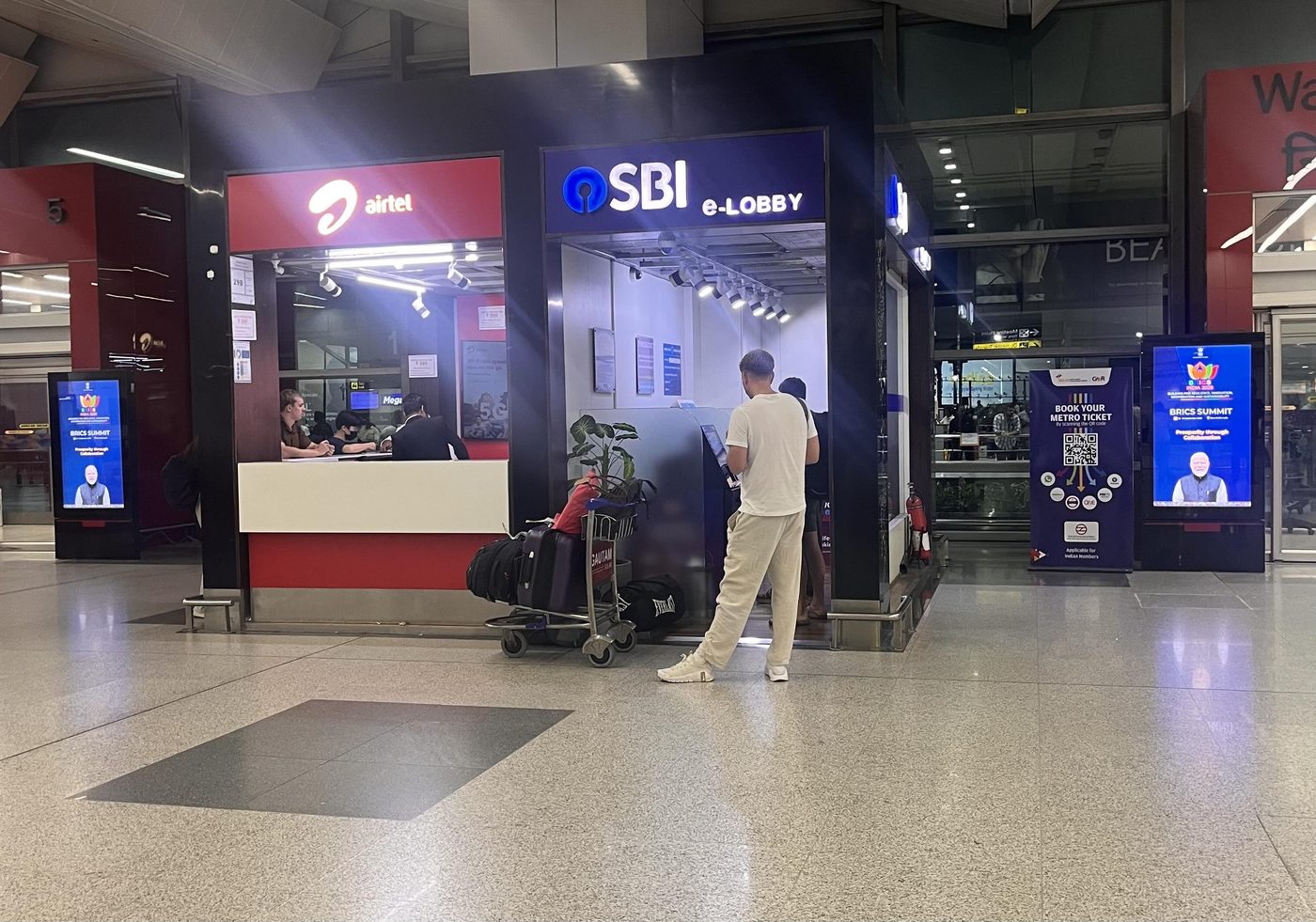 The SBI e-Lobby next to the Airtel counter inside the arrivals hall
